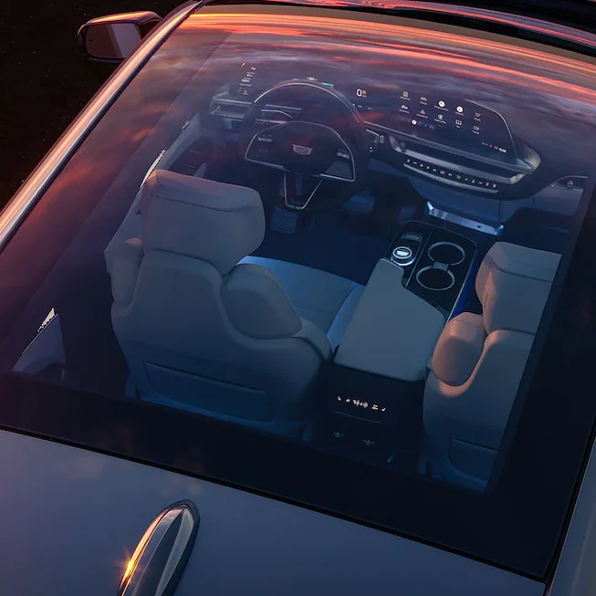 Overhead shot looking through the glass roof into the interior of the Cadillac Lyriq