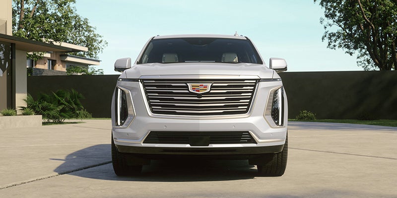 Front exterior view of a white Cadillac SUV outdoors